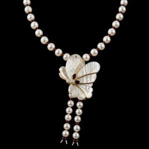 Necklace with pearls and a carved mother-of-pearl butterfly centerpiece